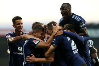 Moritz Heyer of Hamburg SV celebrates scoring his teams second goal of the game wtmduring the Second Bundesliga match between Holstein Kiel and Hamburger SV at Holstein-Stadion on September 09, 2022 in Kiel, Germany.