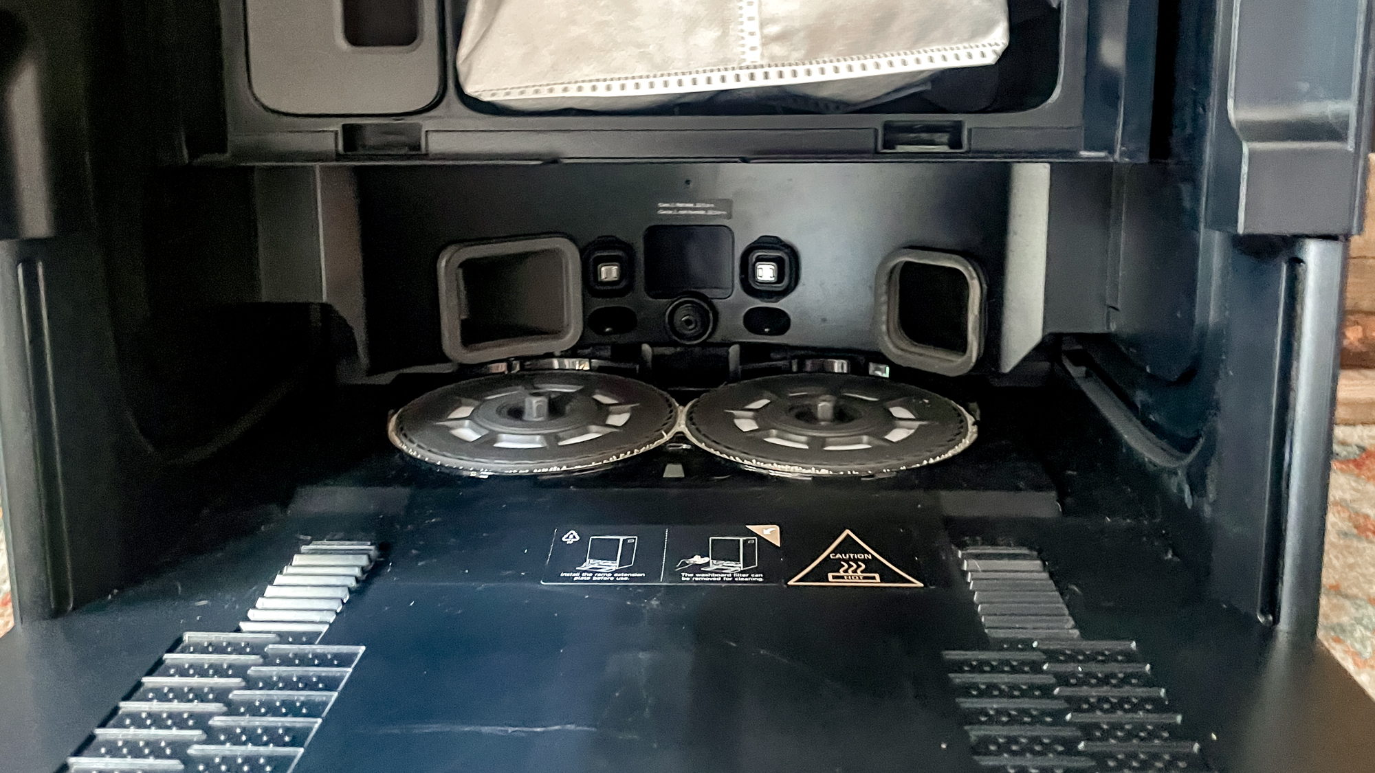 Inside of the Mova Mobius 60 robot vacuum base station