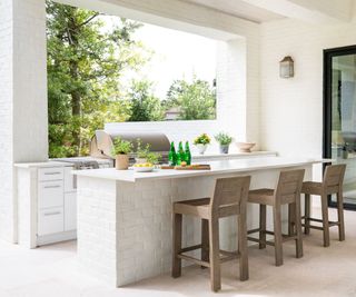 Outdoor kitchen island in a white finish