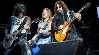 Ace Frehley onstage with Talismen Ryan Spencer Cook (left) and Philip Shouse