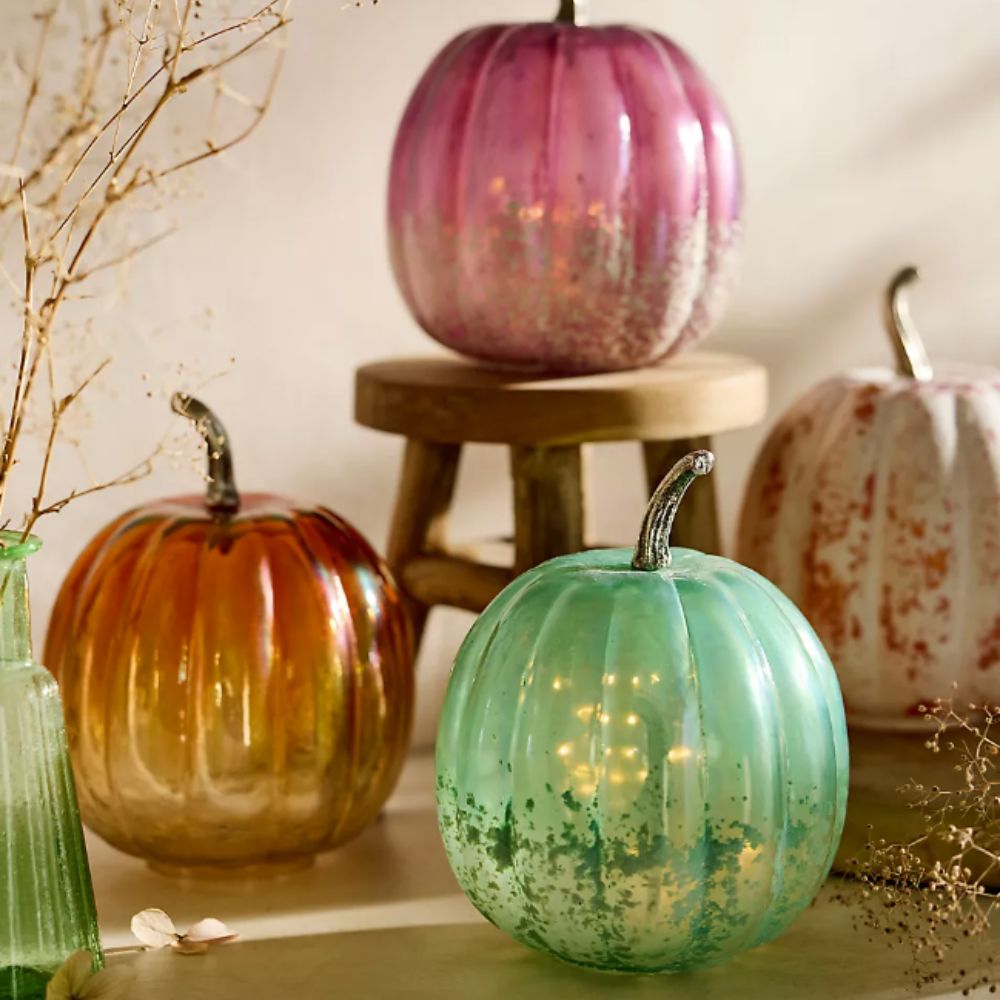 glass pumpkins in green, orange and purple 
