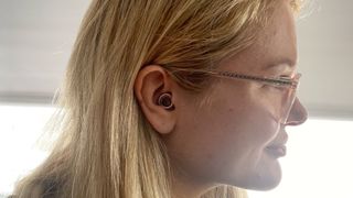 TechRadar writer Becca wearing the loop experience earplugs