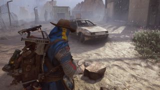 Arc Raiders light bulb locations: A player wearing a blue poncho and a cowboy hat looking at a rusted car in the rain outside an abandoned power facility.