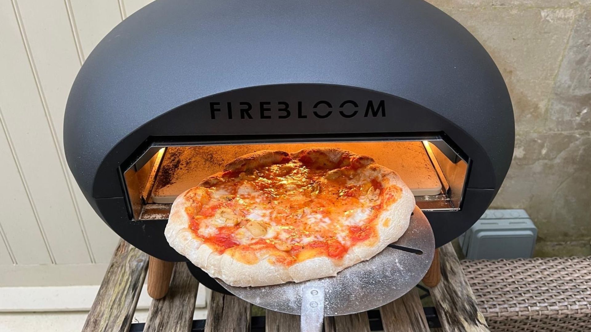 The Firebloom EP03 Electric Pizza Oven being tested in a courtyard