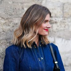 woman with soft curls and red lipstick