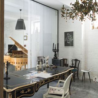 room with table desk and white wall