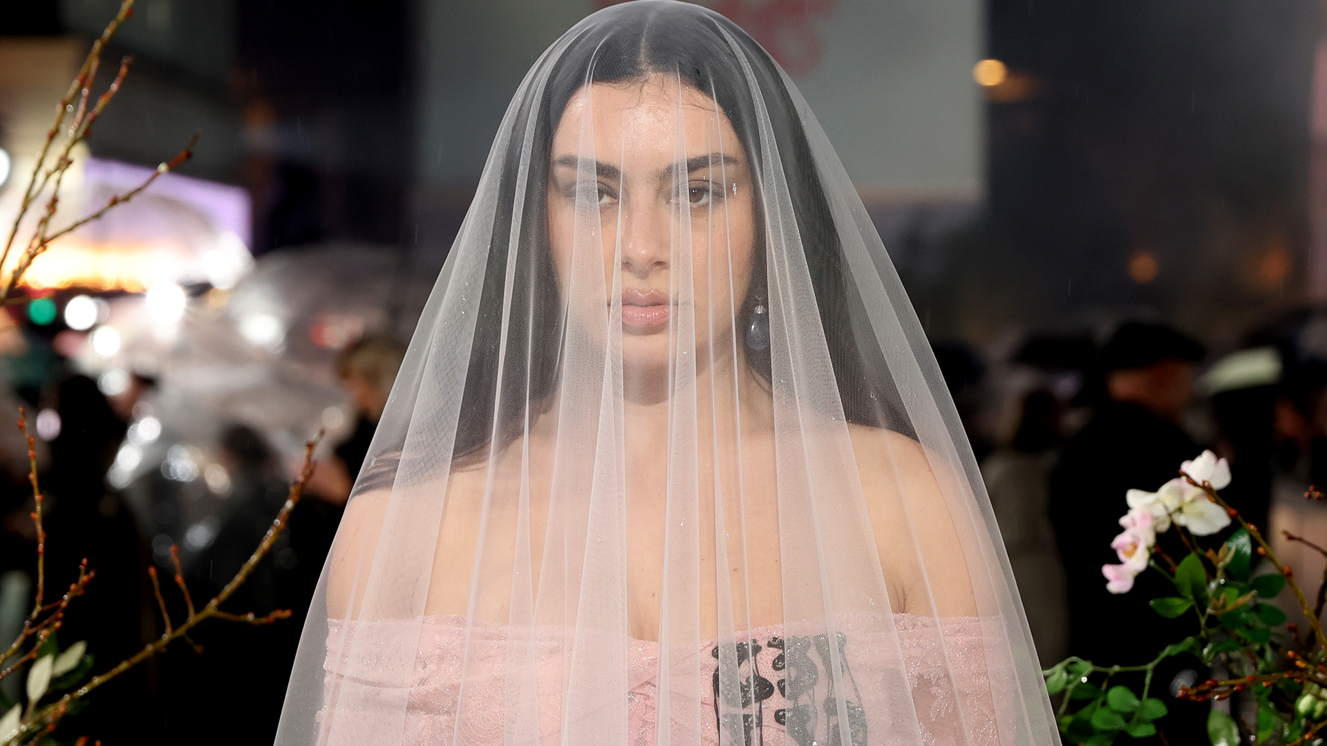 Charli xcx arrived at the London premiere of Wuthering Heights looking every bit a brat bride in a pink gown and veil
