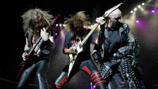 Judas Priest performing onstage in 2004