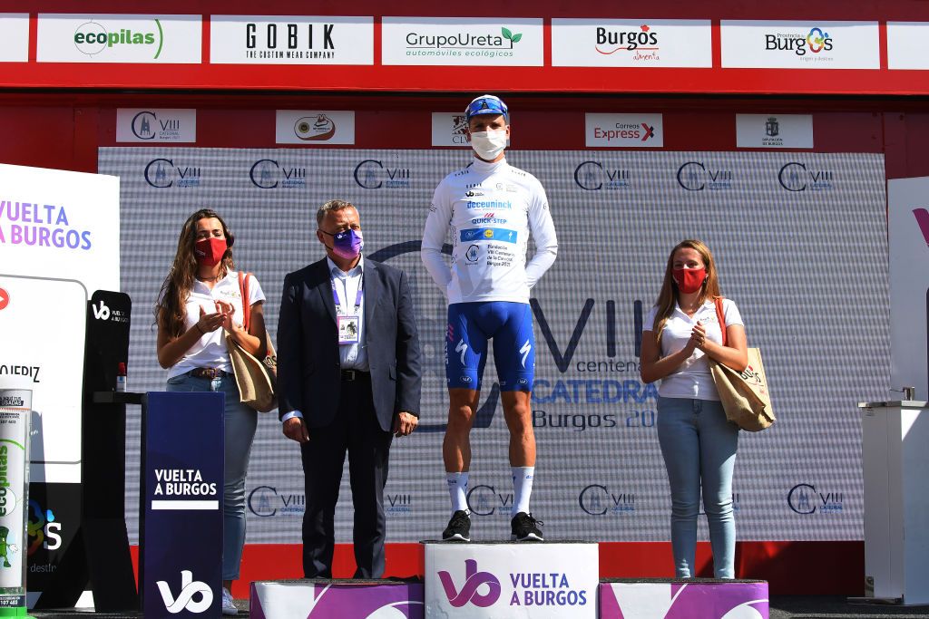 VILLADIEGO SPAIN JULY 29 Podium Joo Almeida of Portugal and Team Deceuninck QuickStep White Best Young Jersey Celebration Hostess Miss Covid Safe measures during the 42nd Vuelta a Burgos 2020 Stage 2 a 168km stage from Castrojeriz to Villadiego VueltaBurgos on July 29 2020 in Villadiego Spain Photo by David RamosGetty Images