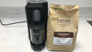 Moccamaster grinder with a bag of Union coffee beans on the right of it