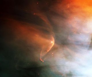 A bow shock blazes in front of a young star zipping around the Orion nebula.