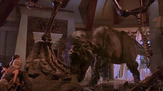 Humans watching Roberta the T-Rex eating a raptor in Jurassic Park.