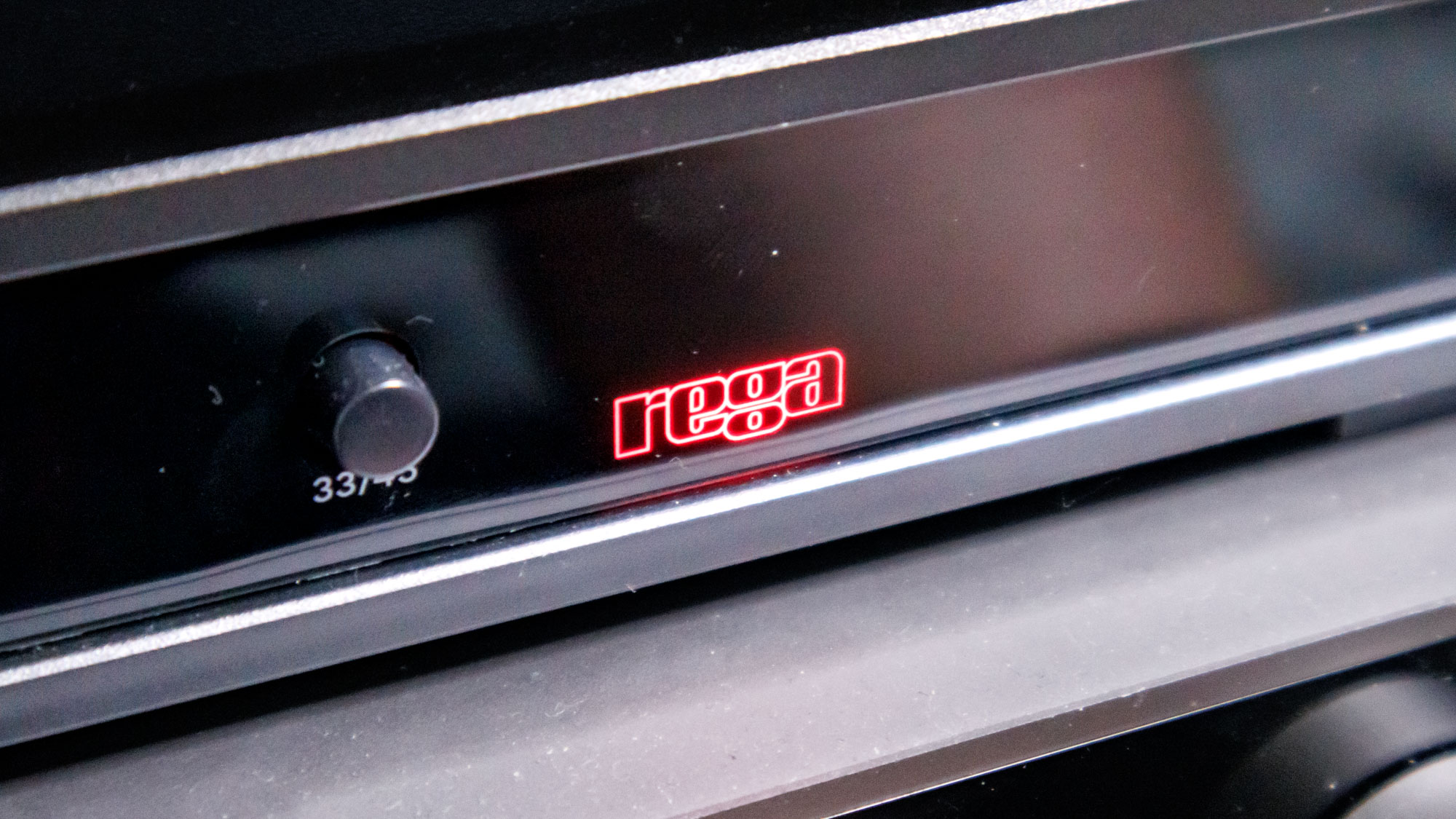 The Rega Planar 3 RS on an entertainment stand.