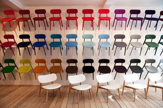 36 Colourful chairs on display