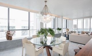 Beaneath Apparatus’ ‘Cloud Chandelier’ is the rotonda glass top dining table by Cassina and the Knoll ‘413 Cab’ dining chairs