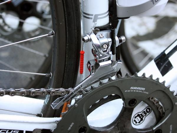 A stiffer steel cage is fitted to Milram's SRAM Red front derailleurs. Rotor's new chain watcher is tucked away in front, too.