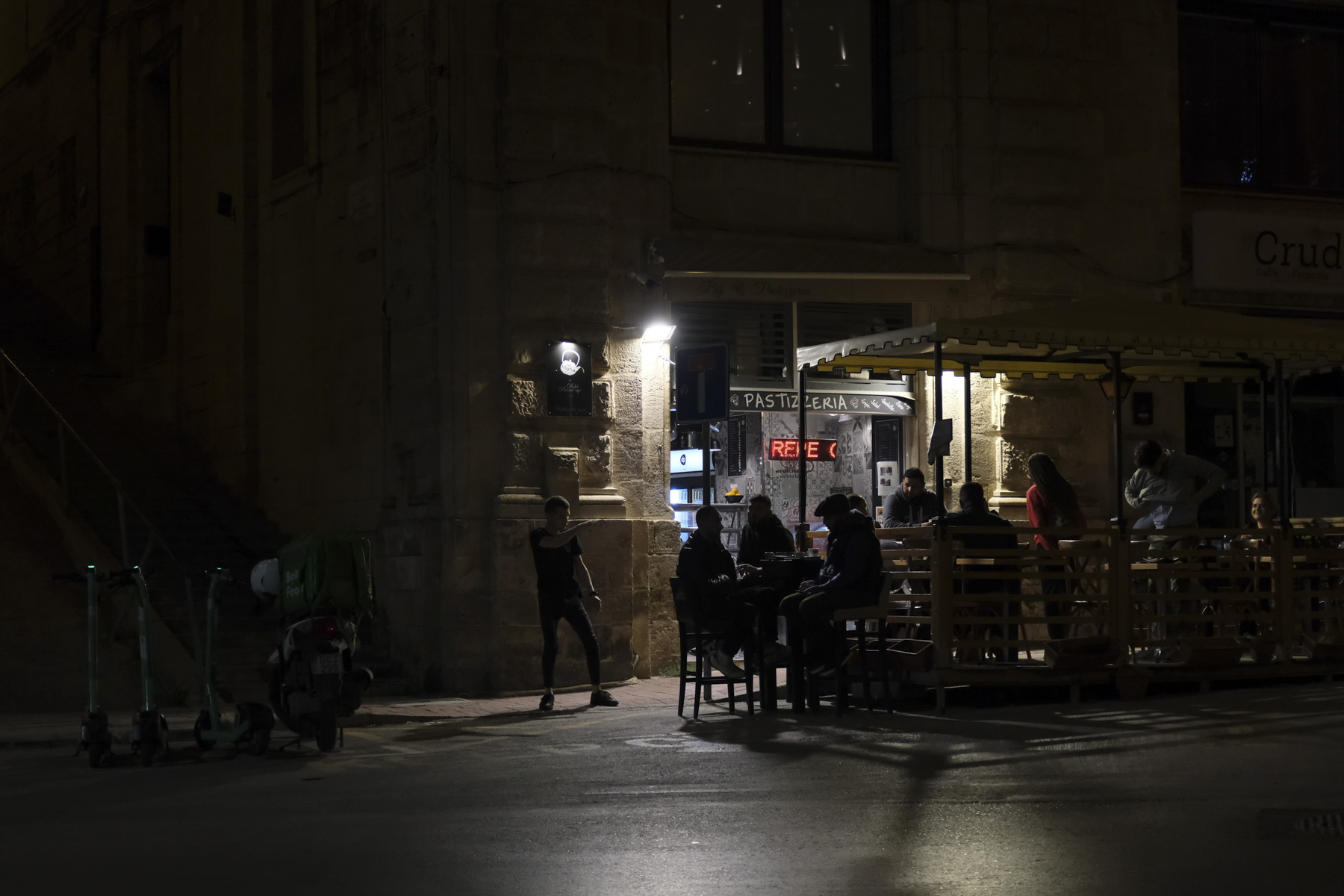 Night street scene outside a cafe