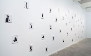 A wall with photographs at the exhibition hall
