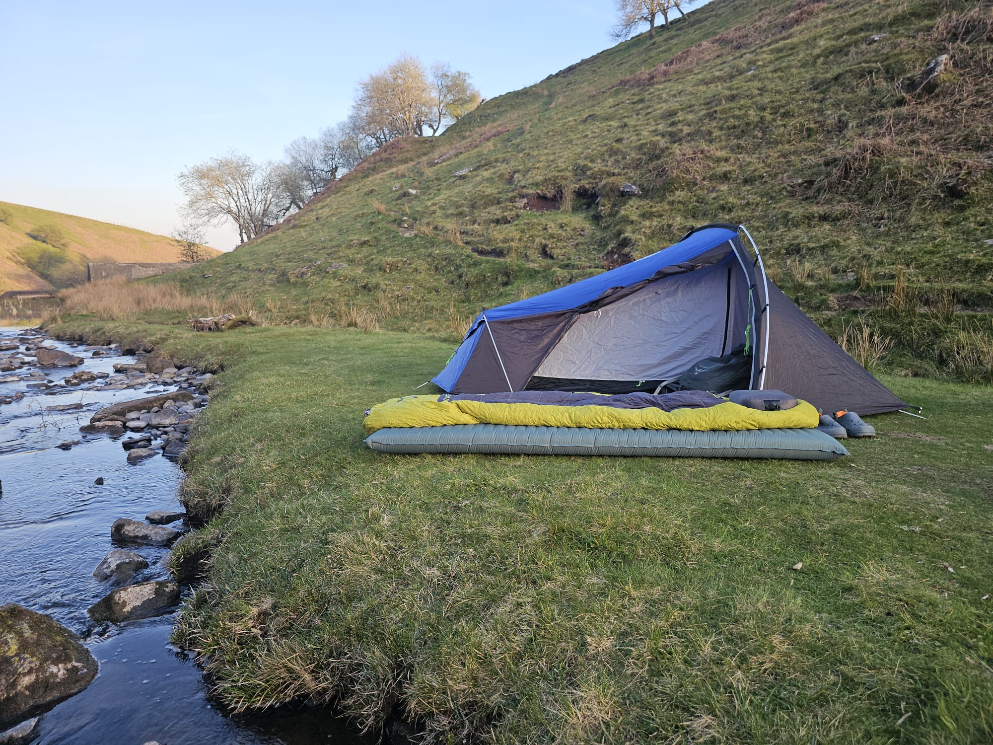 Thermarest sleeping mat shown in front of a backpacking tent