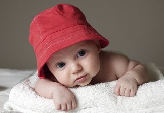 A cute baby in a red hat