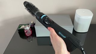 The Revamp Progloss Airstyle 6-in-1Air Styler DR-1250 with the barrel brush attachment connected