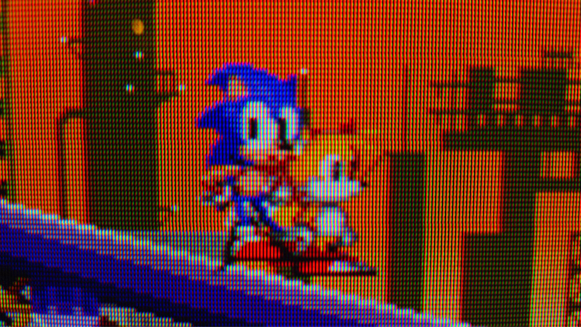 Close up of Sonic the Hedgehog 2 gameplay on Sony CRT TV with Sonic and Tails sprites standing on a slope.