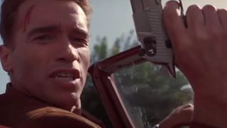 Arnold Schwarzenegger with a gun in his hand in Last Action Hero