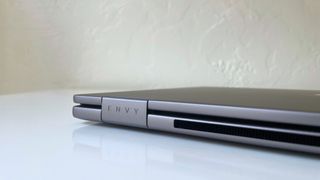 Close up of the Envy logo and rear vents on the HP Envy x360 2-in-1