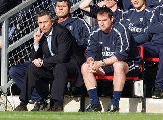 Chelsea manager Jose Mourinho and assistant manager Steve Clarke look on from the bench during a Premier League match against Southampton, 2005