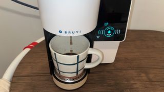 pouring into a mug with the bruvi coffee maker