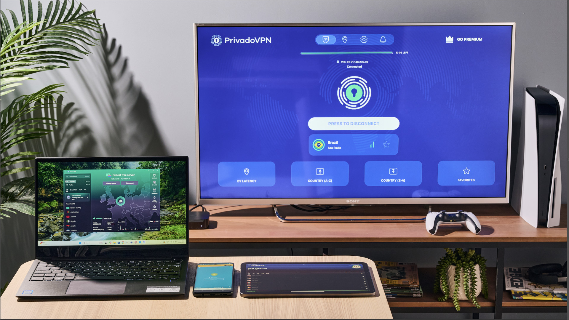 Free VPN apps running on a laptop, tablet, mobile phone and a monitor.