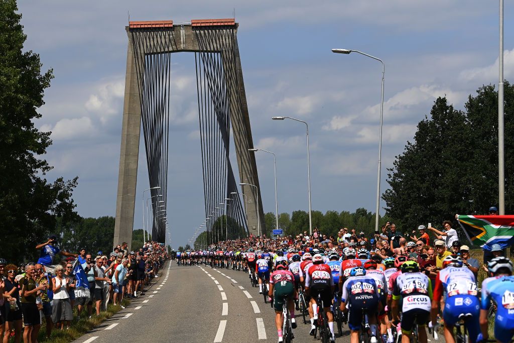 UTRECHT NETHERLANDS AUGUST 20 A general view of the peloton passing across a bridge landscape during the 77th Tour of Spain 2022 Stage 2 a 1751km stage from sHertogenbosch to Utrecht LaVuelta22 WorldTour on August 20 2022 in Utrecht Netherlands Photo by Tim de WaeleGetty Images