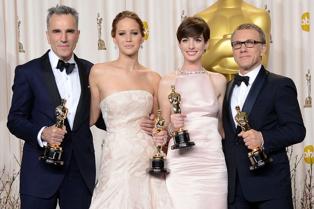 Daniel Day-Lewis, Jennifer Lawrence, Anne Hathaway, and Christoph Waltz at the 2013 Oscars ceremony.