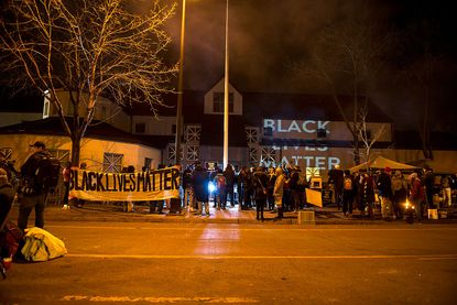 Protesters near Minneapolis Police Department's 4th precinct camp out to highlight death of Jamar Clark