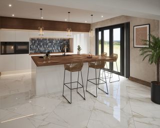 Gold gloss marble effect tiles in white kitchen