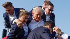 Former President Donald Trump is rushed offstage by U.S. Secret Service agents after being grazed by a bullet during a rally on July 13, 2024 in Butler, Pennsylvania
