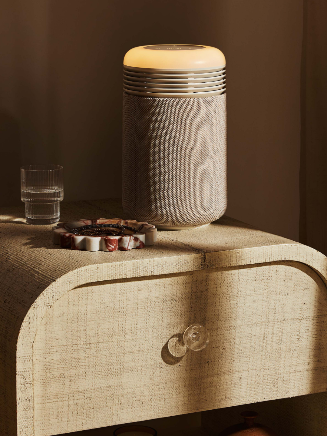 A beige air purifier and sun clock from Blueair