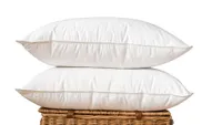 Two Scooms Hungarian Goose Down pillows piled on a basket