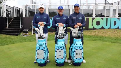 Majesticks GC co-captains pose for a photo in front of their golf bags