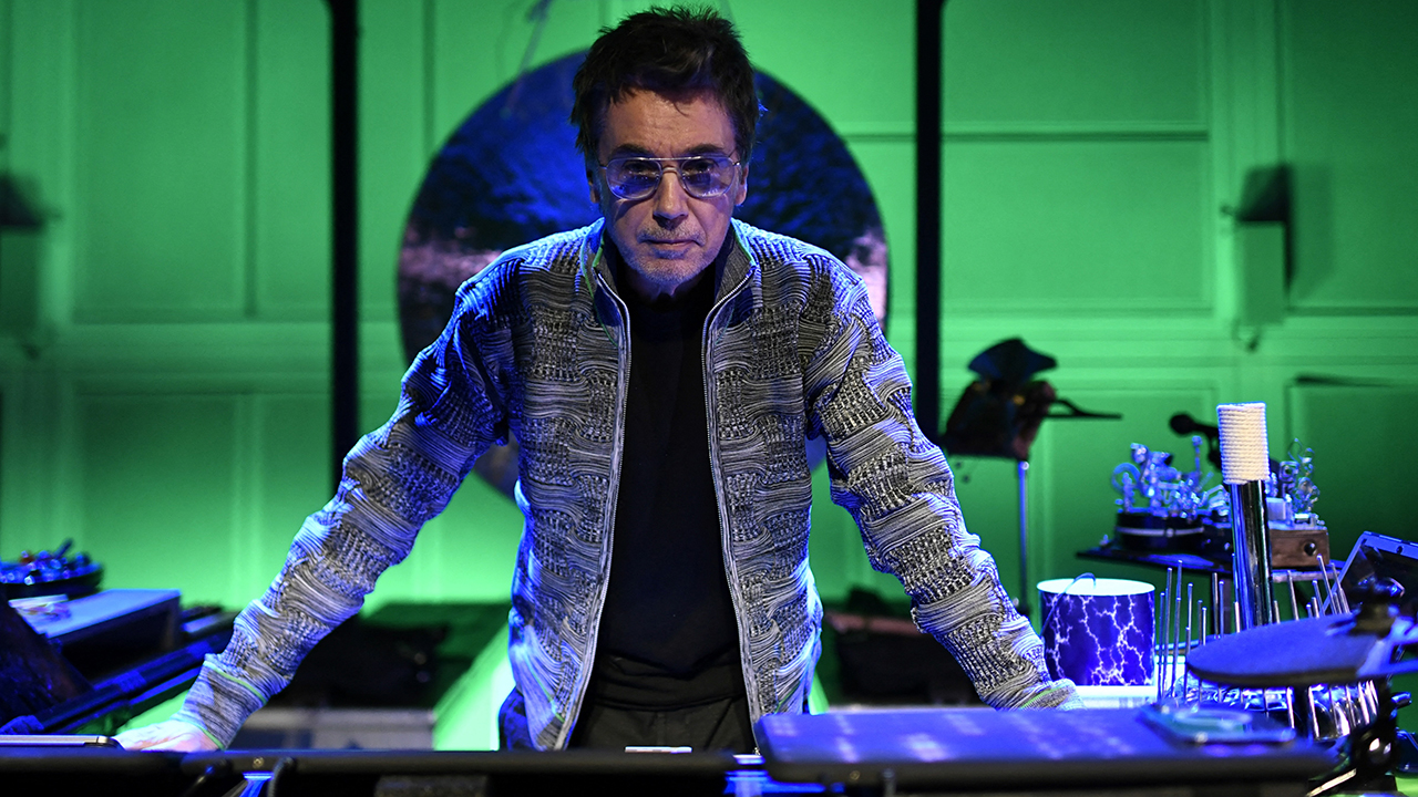 French composer and producer Jean-Michel Jarre poses on stage during a photo session at the Ircam music studio in Paris, on January 13, 2023. (Photo by STEPHANE DE SAKUTIN / AFP)