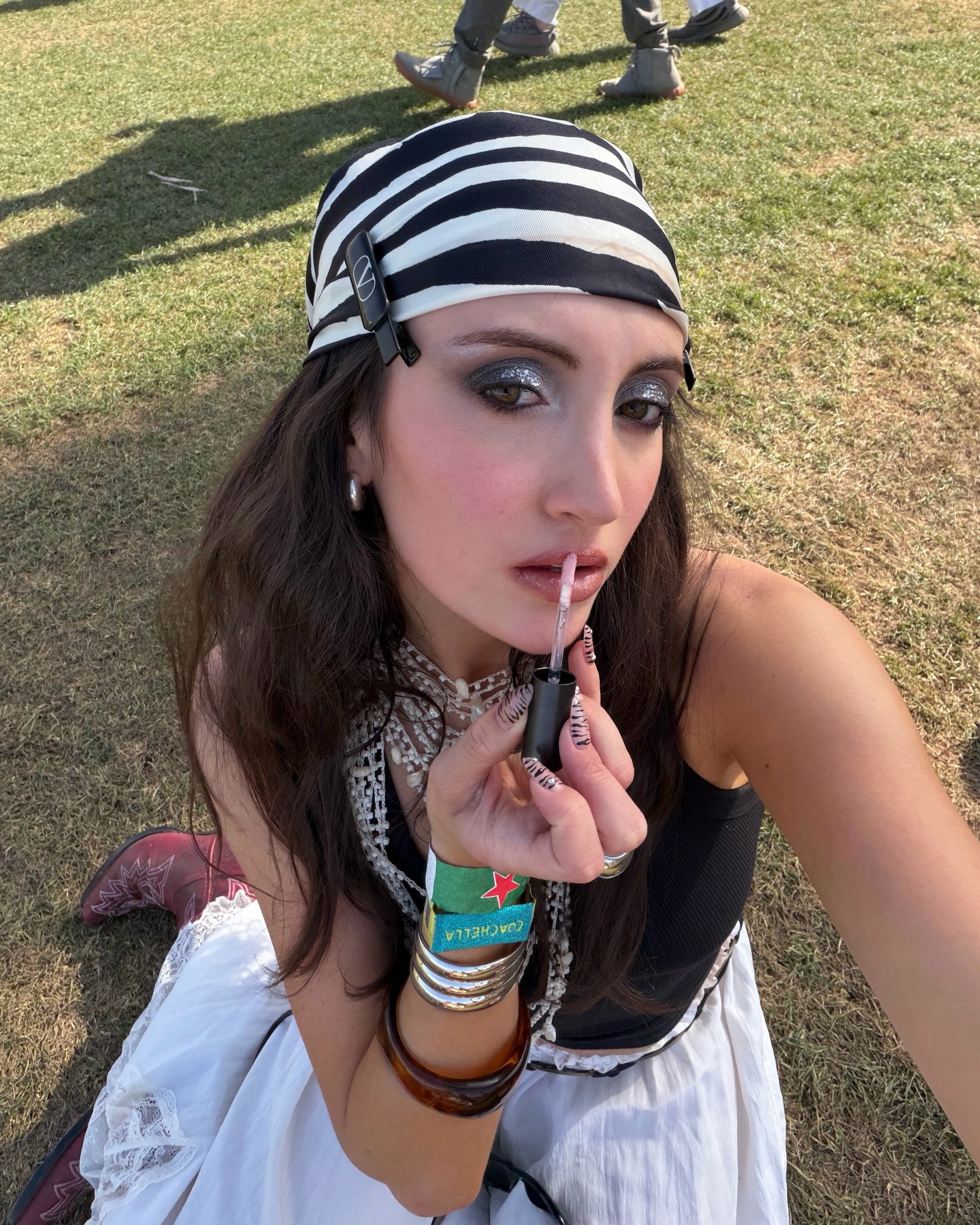 WWW associate beauty editor Alyssa Brascia applying lip gloss.