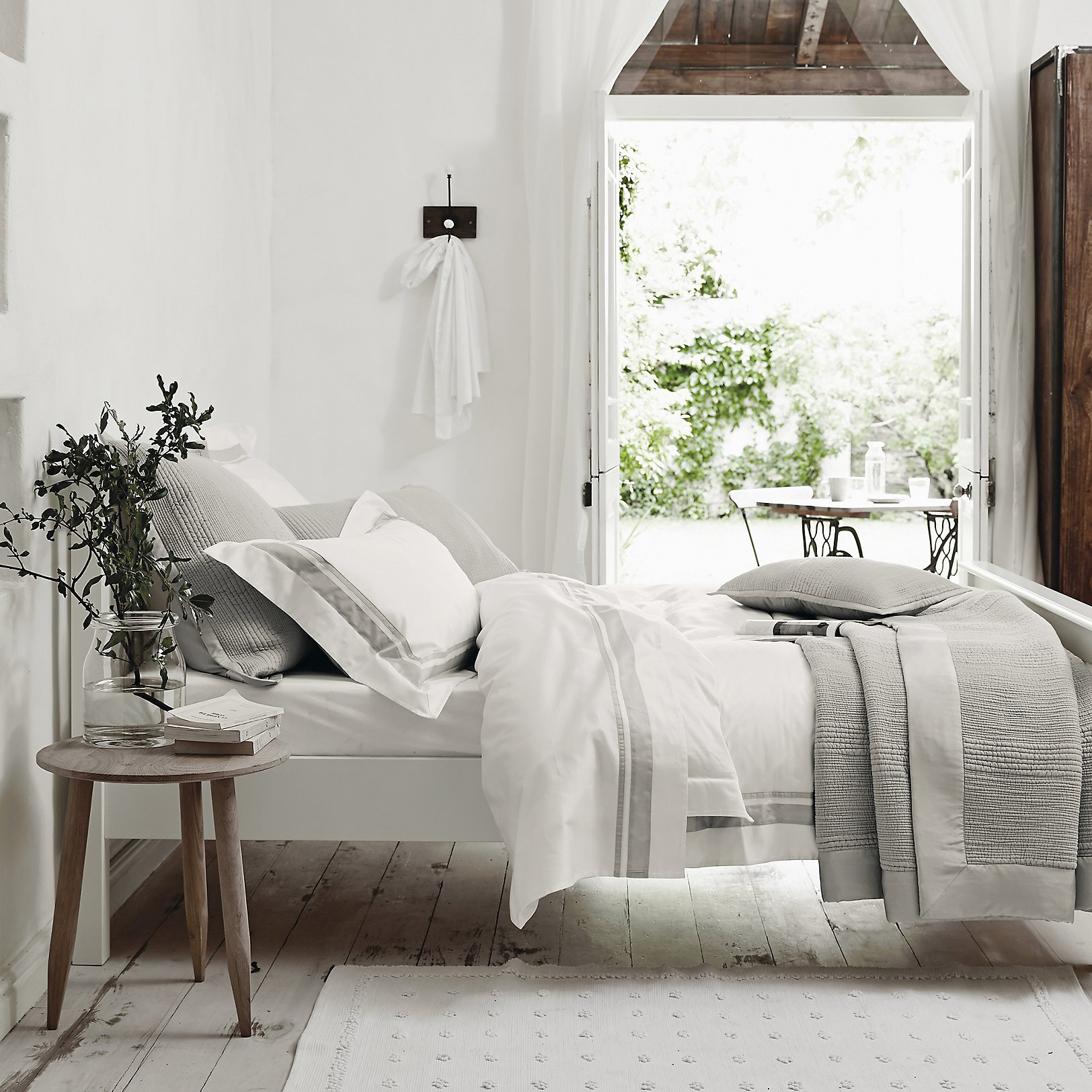 White bed linen in a guest bedroom
