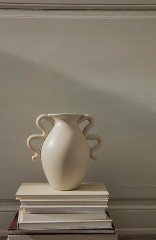 cream ceramic vase with wavy handles