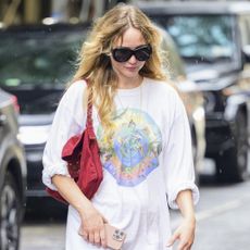 Jennifer Lawrence rewore her summer outfit formula, white lacy pants with The Row sandals