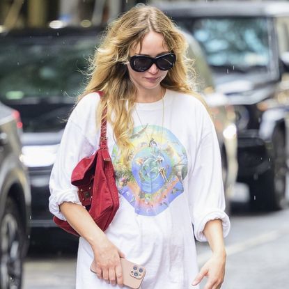 Jennifer Lawrence rewore her summer outfit formula, white lacy pants with The Row sandals