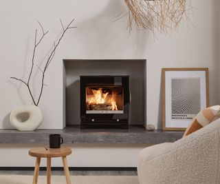 modern log burner in hole-in-the-wall fireplace