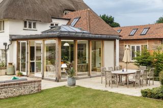 sunroom extension with roof lantern in garden