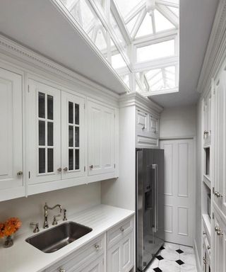 gray kitchen in narrow space with roof lantern
