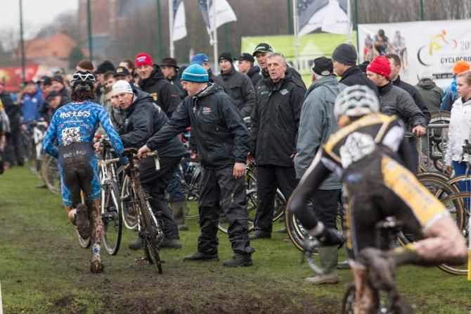 In the trenches; Geoff Proctor (white hat) handing up to Curtis White on his way to 3rd place, Loenhout bPost junior race, December 2012.