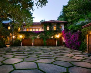 stone driveway with lights
